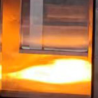 如何通过试验来判断材料是否属于难燃性建筑材料？